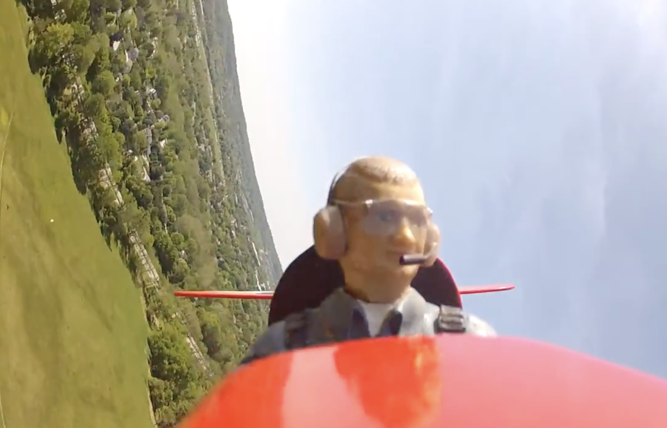 Head-turning pilot RC airplane in flight